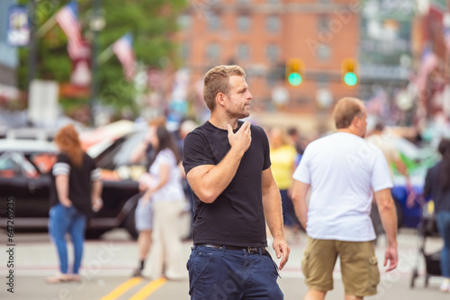 Handsome guy white man photographer looking at the camera, selective focus bokeh background, model perfect for dating app , people lifestyles urban setting.