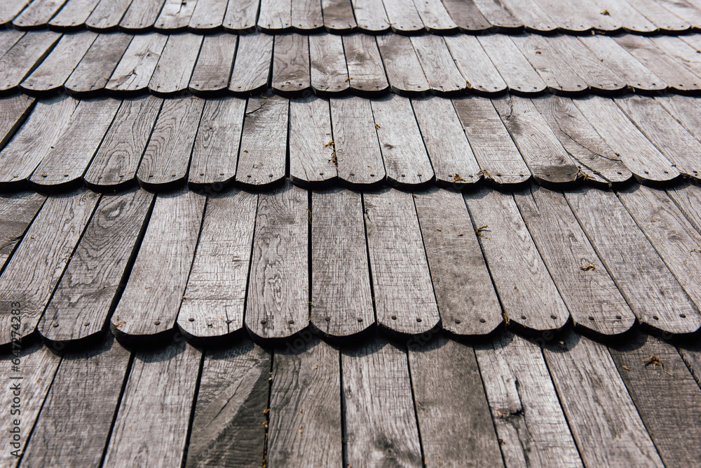 Unpainted wooden roof tiles, gray natural wooden surface texture background Unpainted wooden roof tiles, gray natural wooden surface texture background