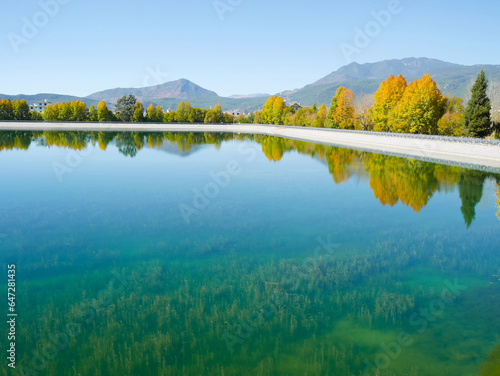 Qingxi reservoir with autumn leaves in Lijiang