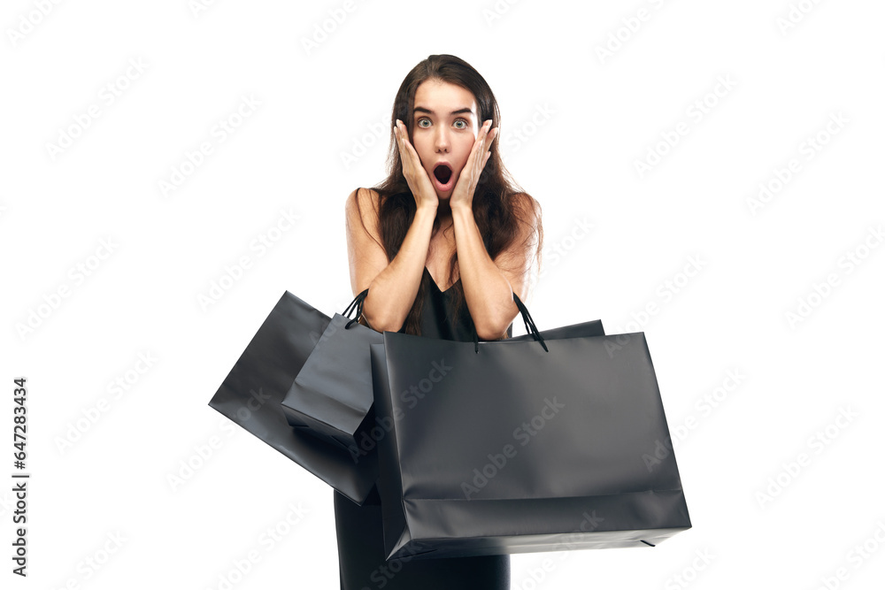 Black friday concept. Portrait of shocked woman wearing black dress raising hands with bags. Beginning season of sales. Black friday concept. Portrait of shocked woman wearing black dress raising hands with bags. Beginning season of sales.