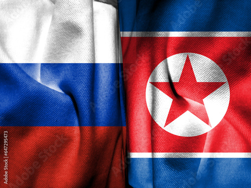 Russian flag and North Korean flag composed with cloth pattern. Concept map depicting a 2023 meeting between the two leaders. Basemap and background concept. Double exposure hologram.