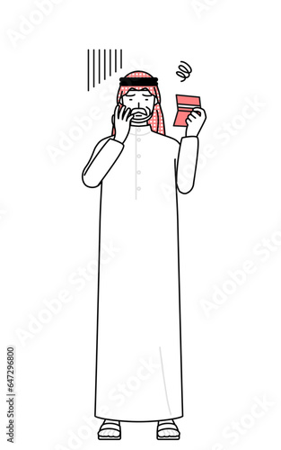 Senior Muslim Man looking at his bankbook and feeling depressed.