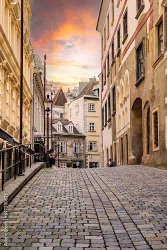 Vienna, Austria. View of the characteristic Greek quarter and Griechengasse street with the sunset sky. Vertical image. 2023-08-02.