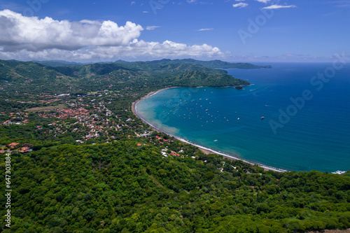 Beautiful aerial view of Playas del Coco, Hermosa Beach and its green mountains, bay and yachts in Costa Rica © Gian