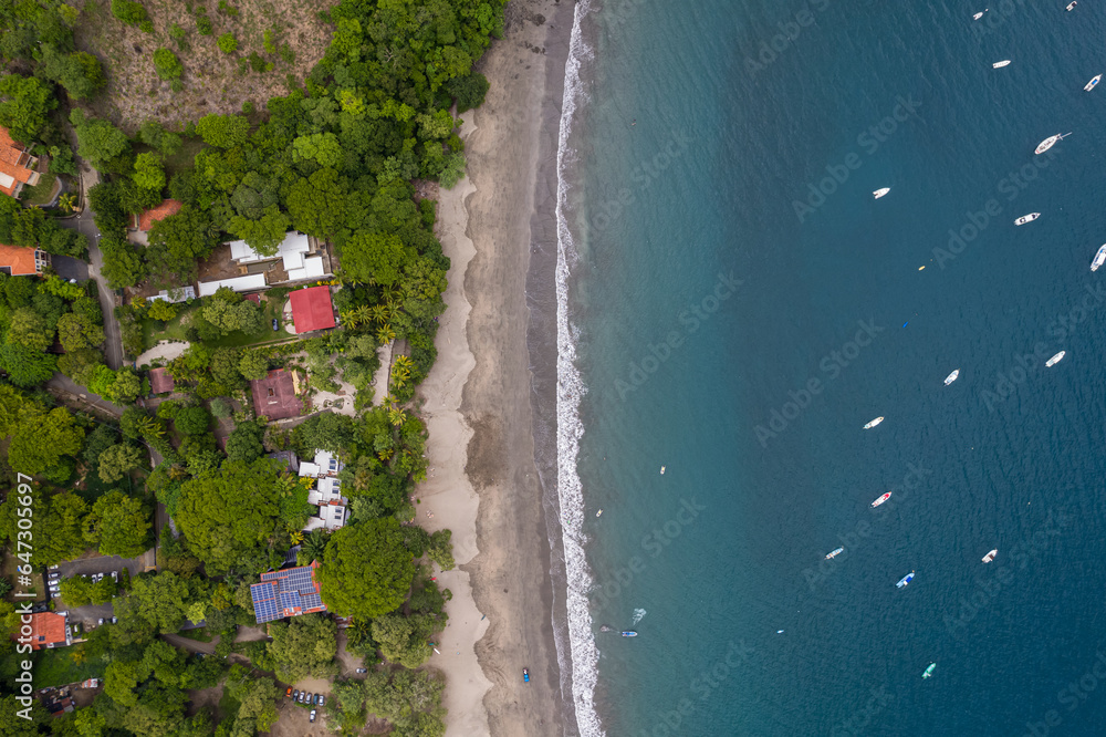 Beautiful aerial view of Playas del Coco, Hermosa Beach and its green mountains, bay and yachts in Costa Rica