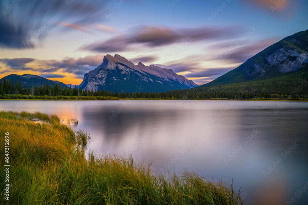 Scenic sunset over Vermilion Lake and Mount Rundle in Banff National Park, Alberta, Canada. Long exposure.