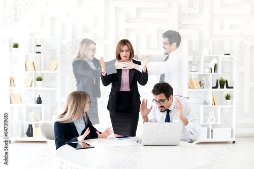 Fotografie Angry boss yelling at employees during the discussion and they imagining their r