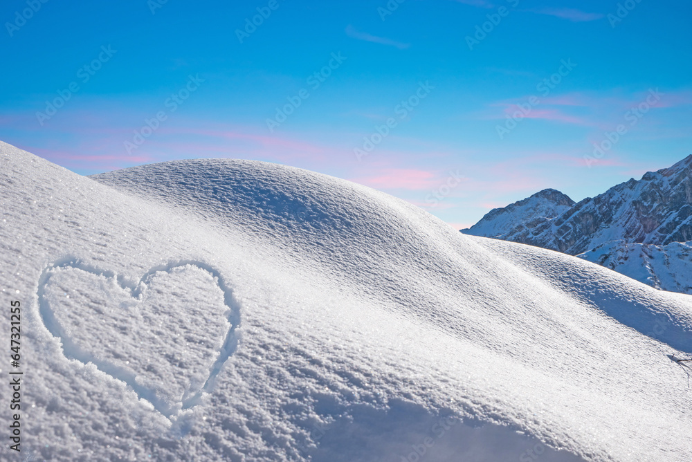 wintry slope with powder snow austrian alps. snowy heart shape and blue sky with copy space - obrazy, fototapety, plakaty 
