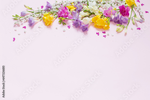 spring flowers on pastel pink background © Maya Kruchancova