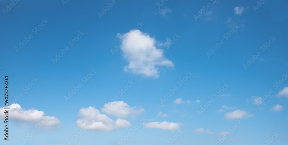 soft sky panorama with floating clouds, one tiny cloud in the middle soft sky panorama with floating clouds, one tiny cloud in the middle