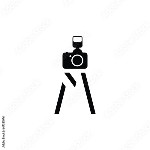 Letter M shaped into a standing camera like tripod