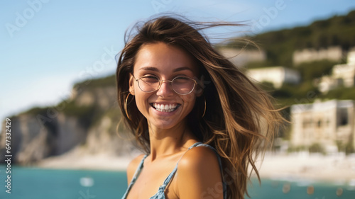 photograph of a smiling beautiful young woman vacationing on the sea , summer vacation © JKLoma