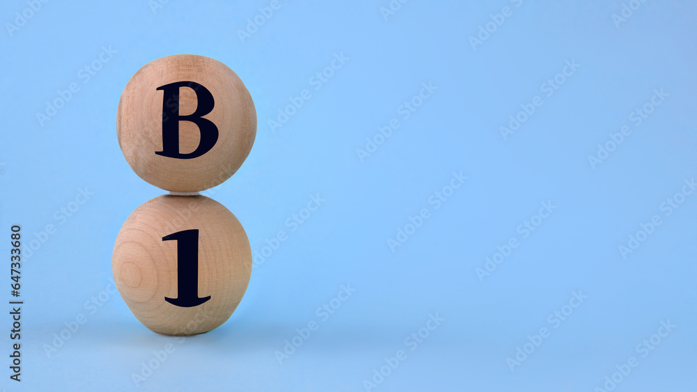 Vitamin B1 on wooden balls on a blue background Vitamin B1 on wooden balls on a blue background