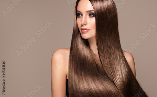 Beautiful model woman with shiny and straight long hair. Keratin straightening. Treatment, care and spa procedures. Beauty girl smooth hairstyle photo