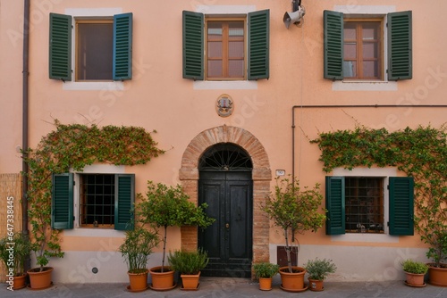 The facade of an ancient palace in Castiglione del Lago, a medieval town in the Umbria region, Italy.