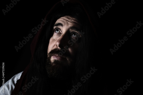 Φωτογραφία portrait of model dressed as Jesus Christ or biblical character with shawl over