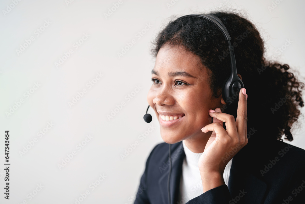 Female call center provides information to a customer calling for help, Contact us, Service with a beautiful and friendly voice, Long call distance communication, Talk using headphones or headsets Female call center provides information to a customer calling for help, Contact us, Service with a beautiful and friendly voice, Long call distance communication, Talk using headphones or headsets