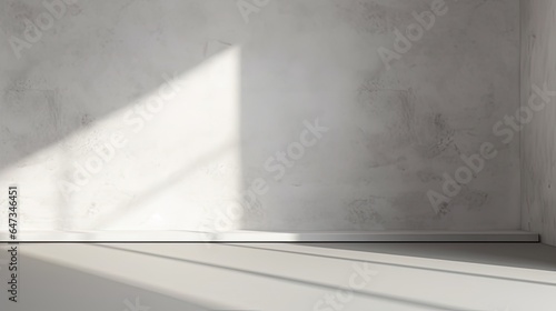 abstract. minimalistic background for product presentation. walls in  large empty room greyish white. can full of sunlight. Loft wall or minimalist wall. Shadow  light from windows to plaster wall...