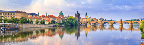 City summer landscape at sunrise, banner - view of the Charles Bridge and the Vltava river in the historical center of Prague, Czech Republic