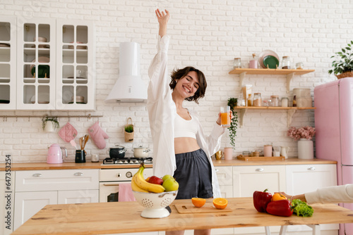 young pretty woman cooking at home, morning kitchen, healthy food