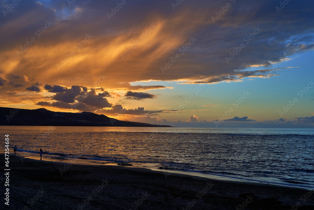 Sunset view at Playa de Las Canteras beach at Las Palmas de Gran Canaria, Spain