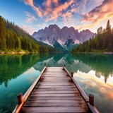 Calm morning view of Fusine lake. Colorful summer sunrise in Julian Alps with Mangart peak on background Province of Udine Italy Europe. Beauty of nature concept background