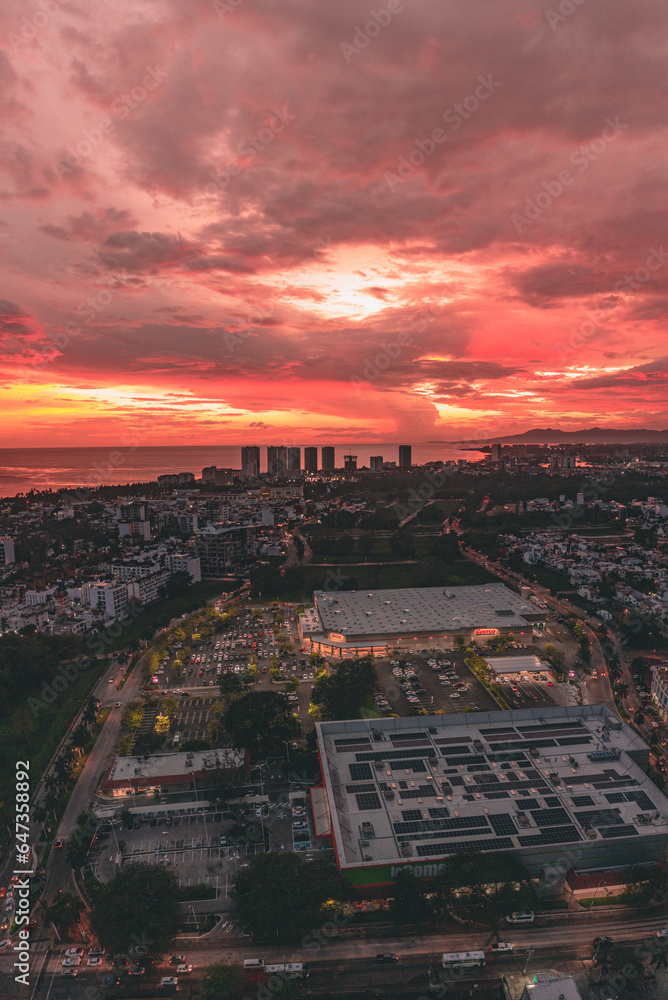 Drone sunset view of Puerto Vallarta city with an impressive red-orange sky