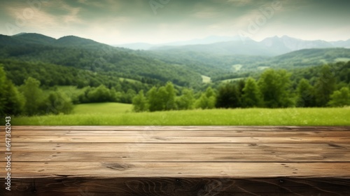 background of old wooden table and green mountain landscape