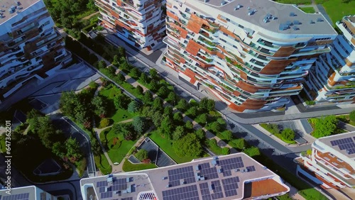 Glass buildings in Europe City Life. Aerial view of modern architecture of dwelling residences in the new districts of the city. Lights of the night city. three towers. Milan, Italy, 10.2023 photo