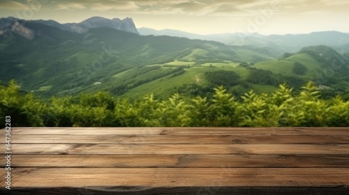 background of old wooden table and green mountain landscape