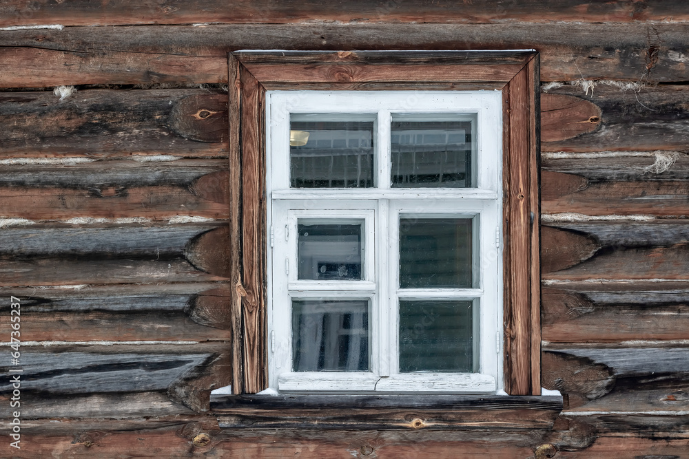 Old rectangular window with a white frame in an old log house. From the series Window of the World.