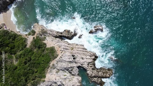 This video features aerial footage captured by a drone, showcasing breathtaking views of waves, the ocean, rugged cliffs, and rocky landscapes.