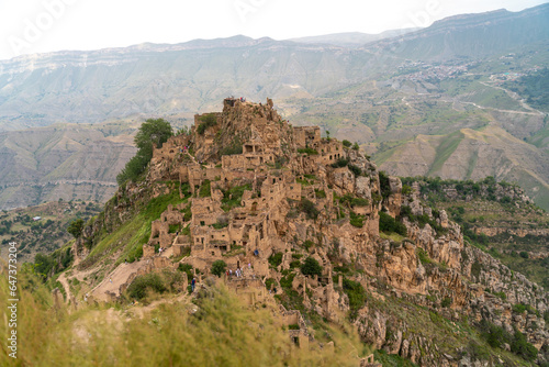 Dagestan Gamsutl. Ancient ghost town of Gamsutl old stone houses in abandoned Gamsutl mountain village in Dagestan, Abandoned etnic aul, summer landscape.