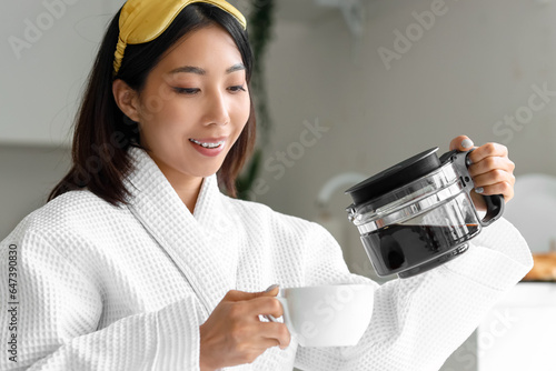 Beautiful Asian woman pouri...