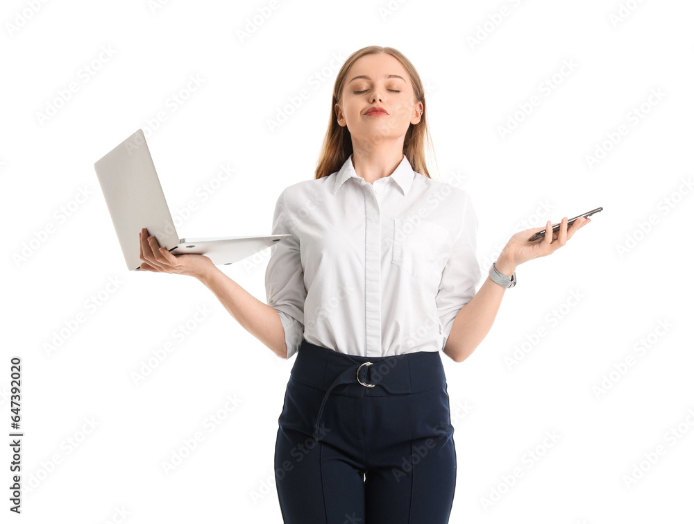 Pretty young businesswoman with laptop and mobile phone on white background Pretty young businesswoman with laptop and mobile phone on white background