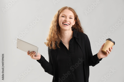 Young businesswoman with ta...