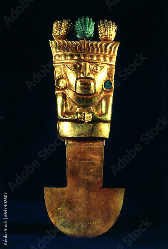 Golden Tumi with embedded gemstones. A medical tool and object for rituals. Peruvian treasure in Gold Museum (Museo del Oro), Lima, Peru - 09.11.20