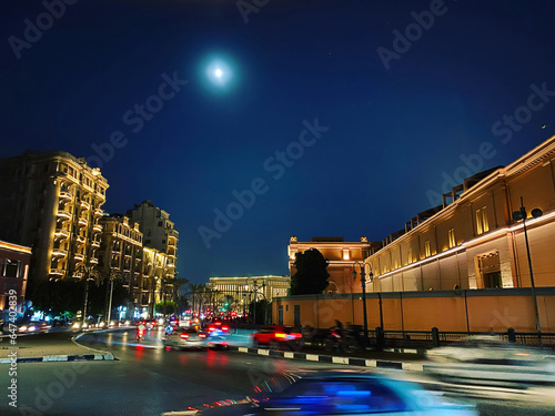 Moonlight, Tahrir square at night, city lights, blurred street traffic photo