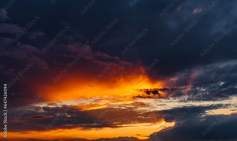 Fiery evening sunset, orange-blue color.