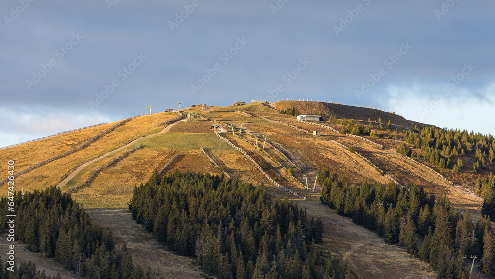 Ski slopes on the Weinebene ski area with missing snow due to warm temperatures caused by climate change Ski slopes on the Weinebene ski area with missing snow due to warm temperatures caused by climate change