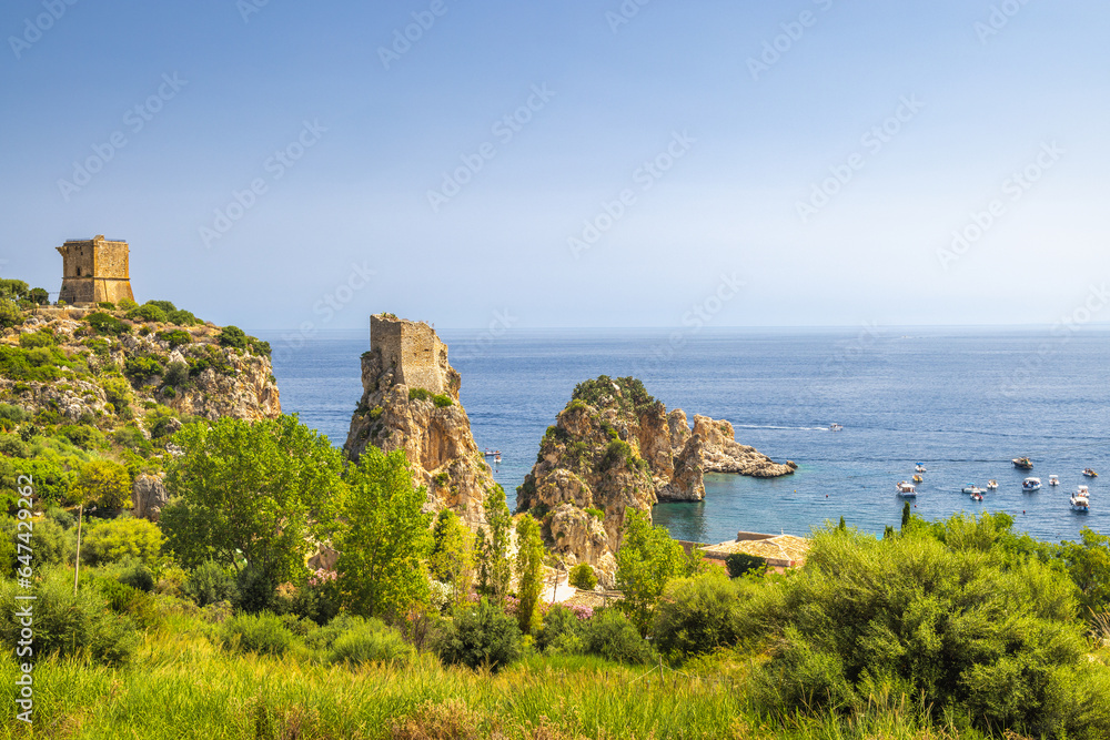 Faraglioni of Scopello - The stacks of Scopello, rocky peaks at sea near of Castellammare del Golfo town at northwestern Sicily, Italy, Europe.