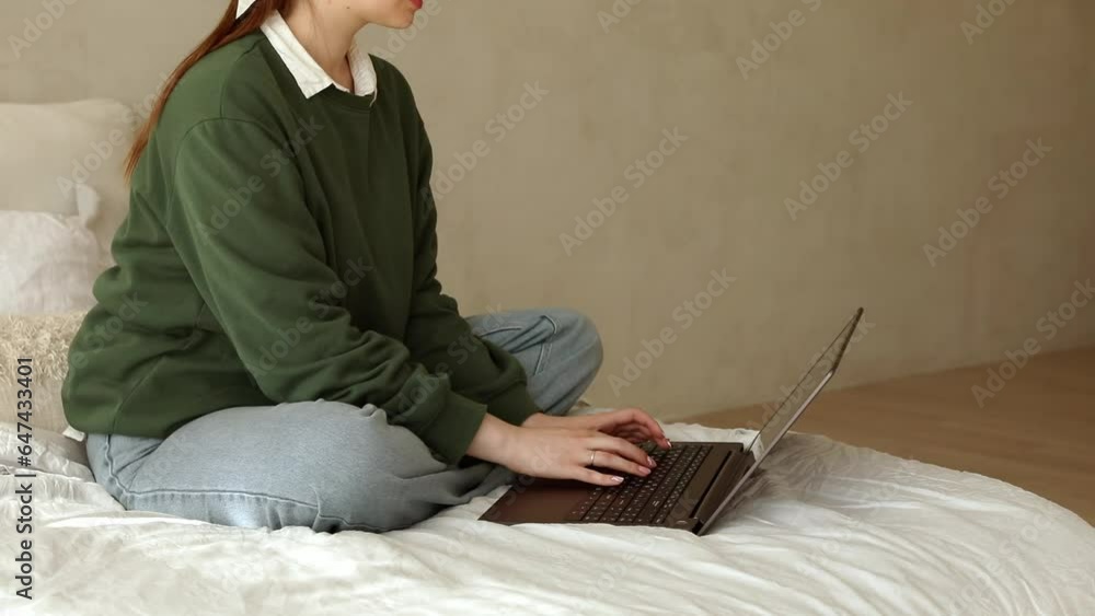Young lady works at lap top at home Young lady works at lap top at home