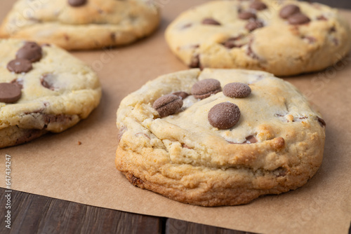 Chocolate chip cookies over brown paper