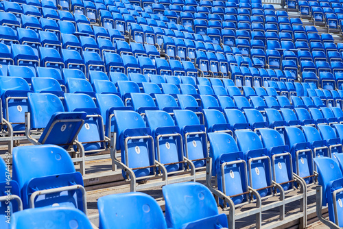 Chairs on the podium of the stadium as a background.