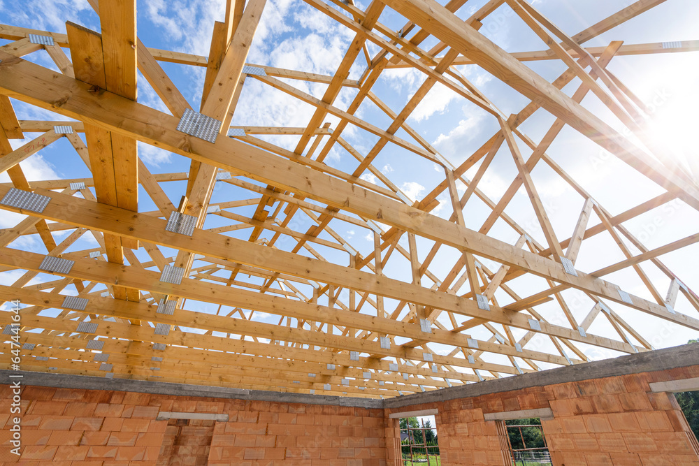 Support elements of wooden framework, new roof, process of building a new home
