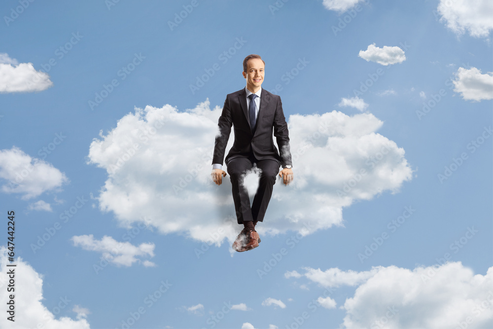 Professional man in suit and tie sitting on a cloud Professional man in suit and tie sitting on a cloud