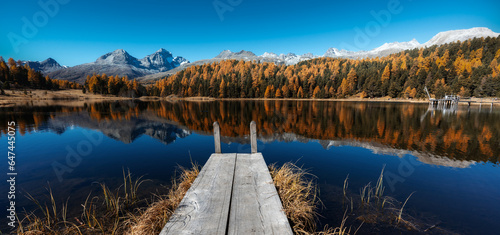 panorama landscape of mountain lake in the Swiss Alps with reflections and autumn colors photo