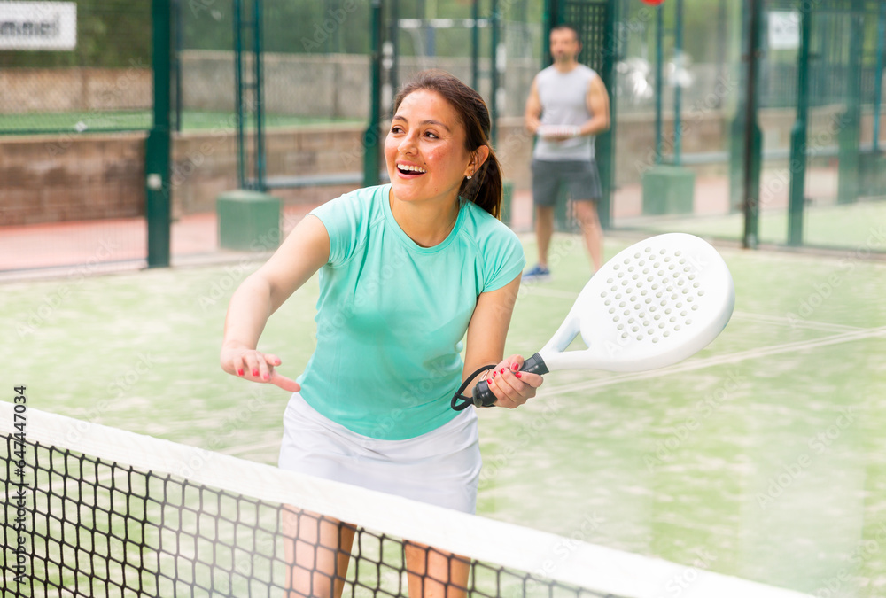 Two sports women playing padel on the tennis court