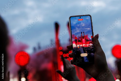 Smartphones in the Hands of the Crowd at an Outdoor Music Event.