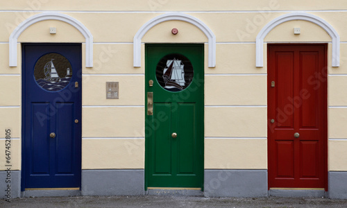Colorful trio of doors in Cobh, Ireland 